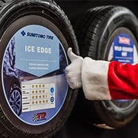 santa giving a thumbs up to an sumitomo ice edge winter tire