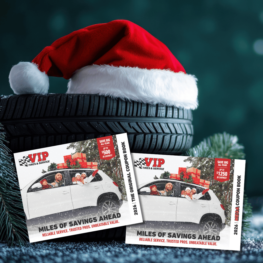 Stack of Tires with santa hat and VIP coupon books