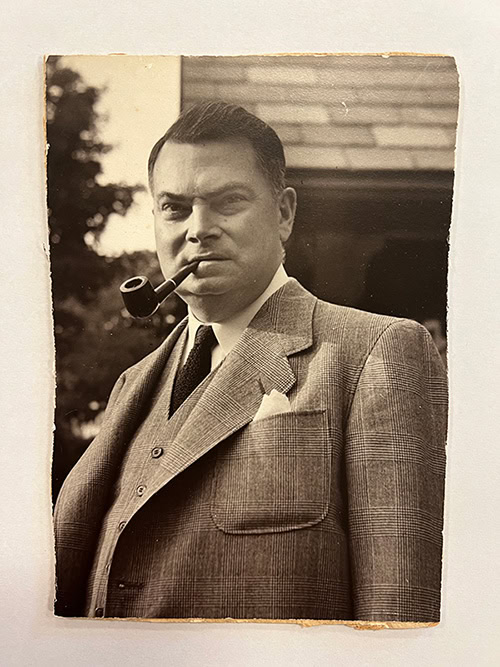 man smoking a pipe from 1955