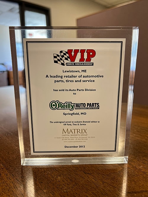 VIP Automotive award plaque recognizing O'Reilly Auto Parts as a leading retailer.