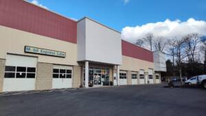 Mobil Express Lube service station with cream and burgundy exterior and multiple garage bays.