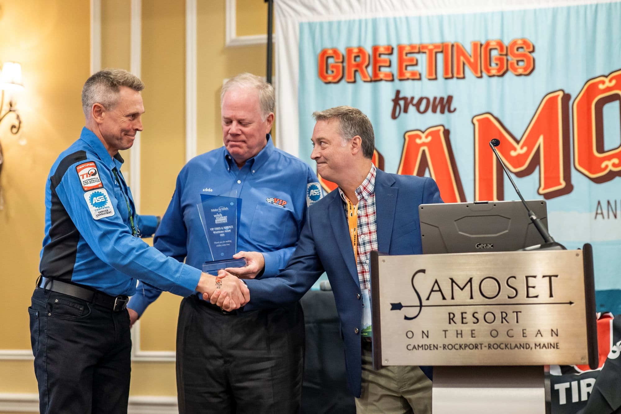Tim Winkler and John Quirk from VIP Tires, granted award from Make A Wish